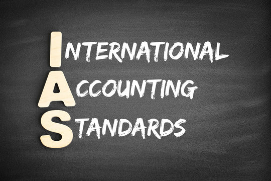 Wooden alphabets building the word IAS - International Accounting Standards acronym on blackboard