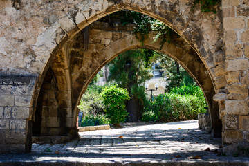 Fototapeta na wymiar old stone arch in the park