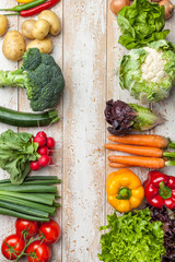 Fresh organic vegetables on rustic background