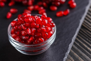 grains of a grenade on a dark rustic background