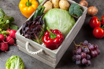 Fresh organic vegetables on rustic background