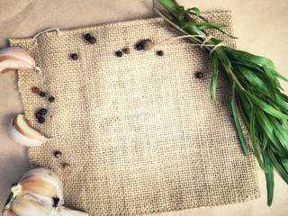 Estragon and spices on the background of  textured linen