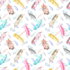 Watercolor boho seamless pattern with colorful bird feathers flying on white background. Hand drawn ethnic tribal illustration.