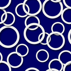 Abstract seamless pattern of randomly arranged white rings with soft shadows on blue background