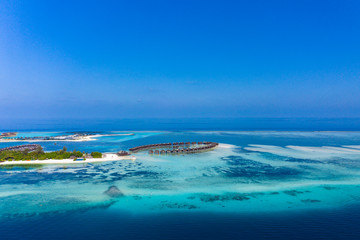 Aerial view, lagoon of Maldives island Olhuveli with Waterbungalows, South Male Atoll, Maldives