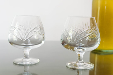 Empty cognac glasses on a table.