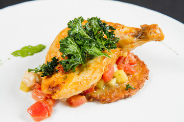 Roasted chicken breast served with potato pancake, pineapple, Italian cheese and cherry tomatoes