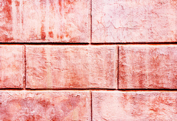 pink-shaped brick tiles with traces of peeling paintLiving Coral Color of the year 2019