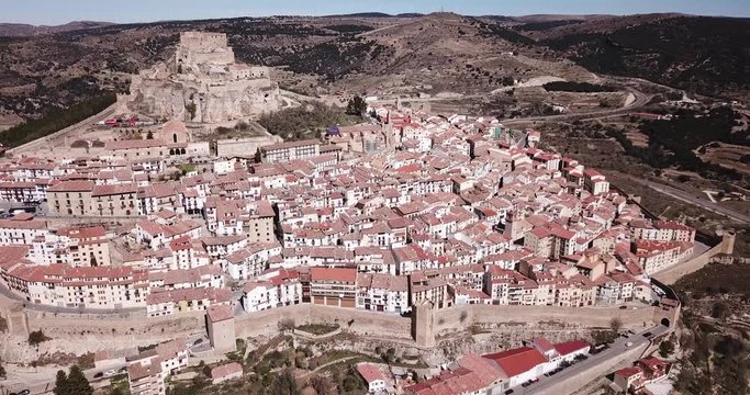 Picturesque aerial view of walled city Morella with medieval Castle on rocky hilltop, Castellon, Spain