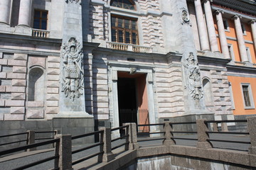 the facade of the Palace with decorations in the form of a bas-relief of armor 