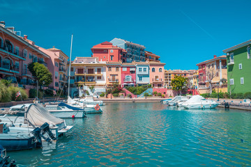 Bright sunny day at Port Saplaya, Valencia's Little Venice. Spain . Yachts docked near  colorful  houses
