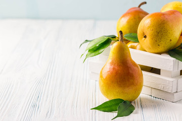 Pears in wooden box.Selective focus, space for text.