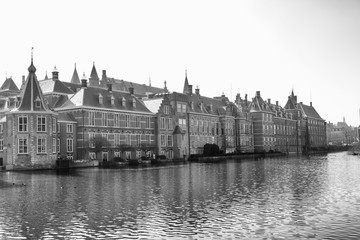 Fototapeta na wymiar View of the Hofvijver / Court Pond adjoined by museum Mauritshuis and the Binnenhof (Inner court) housing the States General and the Prime Minister of The Netherlands in The Hague, The Netherlands. 