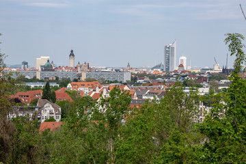 Fototapeta premium Panorama of the city of Leipzig with views of the new city hall, city skyscraper, monument to the Battle of the Nations.Taken from the mountain Fockeberg