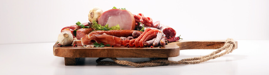 Variety of meat products including ham and sausages.