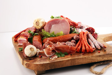 Variety of meat products including ham and sausages.