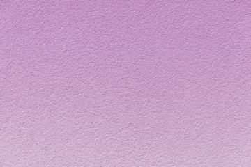 Concrete wall painted in a gentle pink gradient.