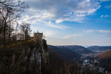 Germany, Popular lichtenstein castle on abrupt cliff of swabian jura above village in vale