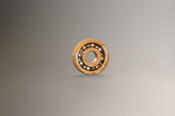 Rusty old stack ball bearing Grey background