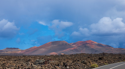 Landscape of a storm over the volcanoes of Timanvaya