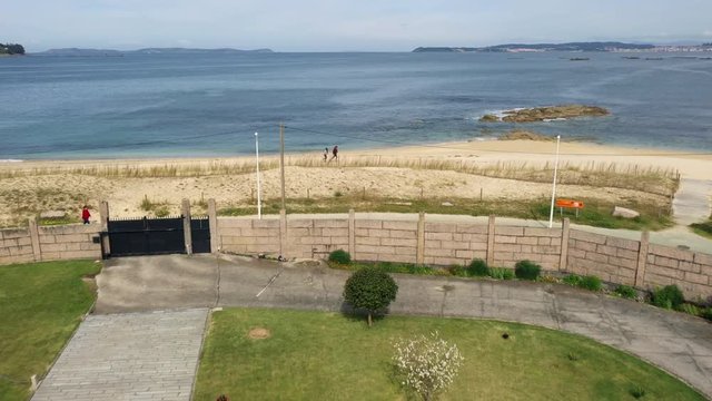 Aerial shot over a big house in Galicia close to the coast with an horreo.