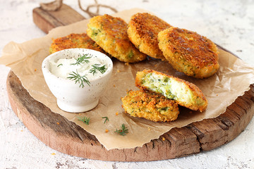 Mozzarella and broccoli fritters with sour cream and dill  