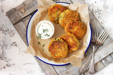 Mozzarella and broccoli fritters with sour cream and dill  