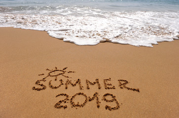 Fototapeta na wymiar Summer 2019 sign on the sand beach