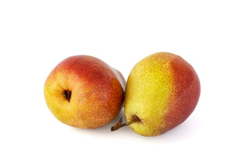 A pair of ripe appetizing red-yellow pear fruits on a white background
