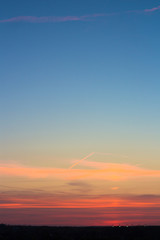 soft pink sunset on a background of dark sky