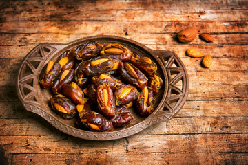 Fresh dates with almonds on a table