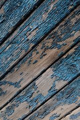 Blue wooden background with cracked paint