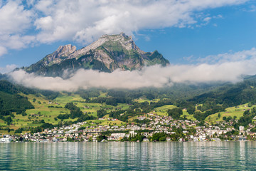 pilatus mountain and hergiswil village at the lake lucerne, switzerland