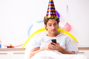 Young man celebrating his birthday in hospital