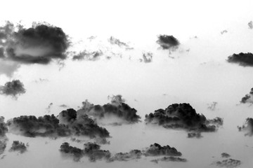 Abstraction of clouds flying like ghosts in the sky - black and white photograph