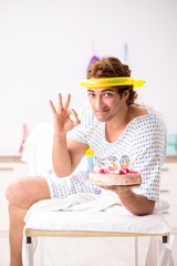 Young man celebrating his birthday in hospital