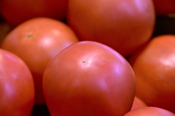 Pile of tomatos on the wagon.