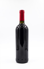 Red wine bottle on the white background.