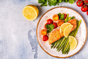 Grilled salmon with asparagus and tomatoes.