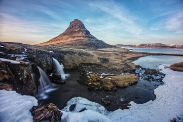 The Mount Kirkjufell of Iceland, captured at the sunset with long exposure