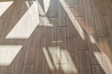 Ceramic tiled flooring with shadow. Terracotta colour