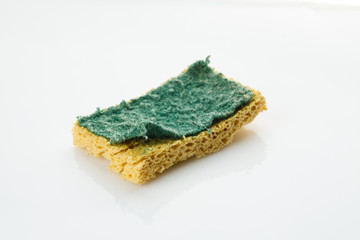 Used cleaning sponge on a white background