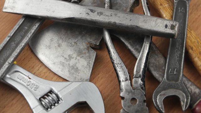 Old locksmith tools laid out on the wooden board, background