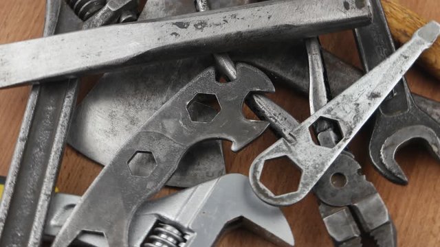 Old locksmith tools laid out on the wooden board, background
