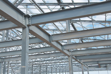 Metal frame of the new building against the sky