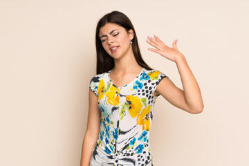Obraz premium Teenager girl with floral dress with tired and sick expression
