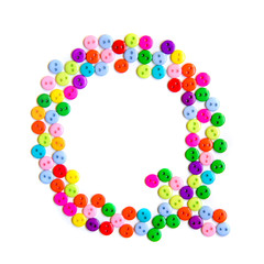 Letter Q of the English alphabet made of multi-colored buttons