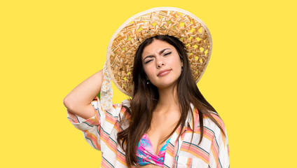 Teenager girl on summer vacation with an expression of frustration and not understanding over isolated yellow background