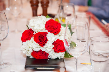 Chicago, IL /United States- December 12, 2012:  large family is coming together to celebrate the happy union of a loving young couple at a upscale restaurant.  wine and food is being served to all. 