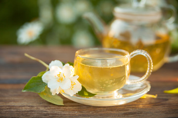 delicious green tea in beautiful glass bowl on table